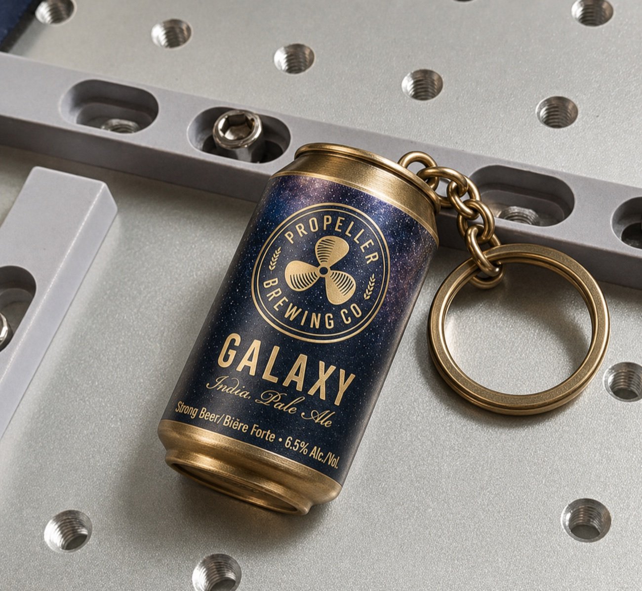 Finished custom metal keychain on a precision work surface