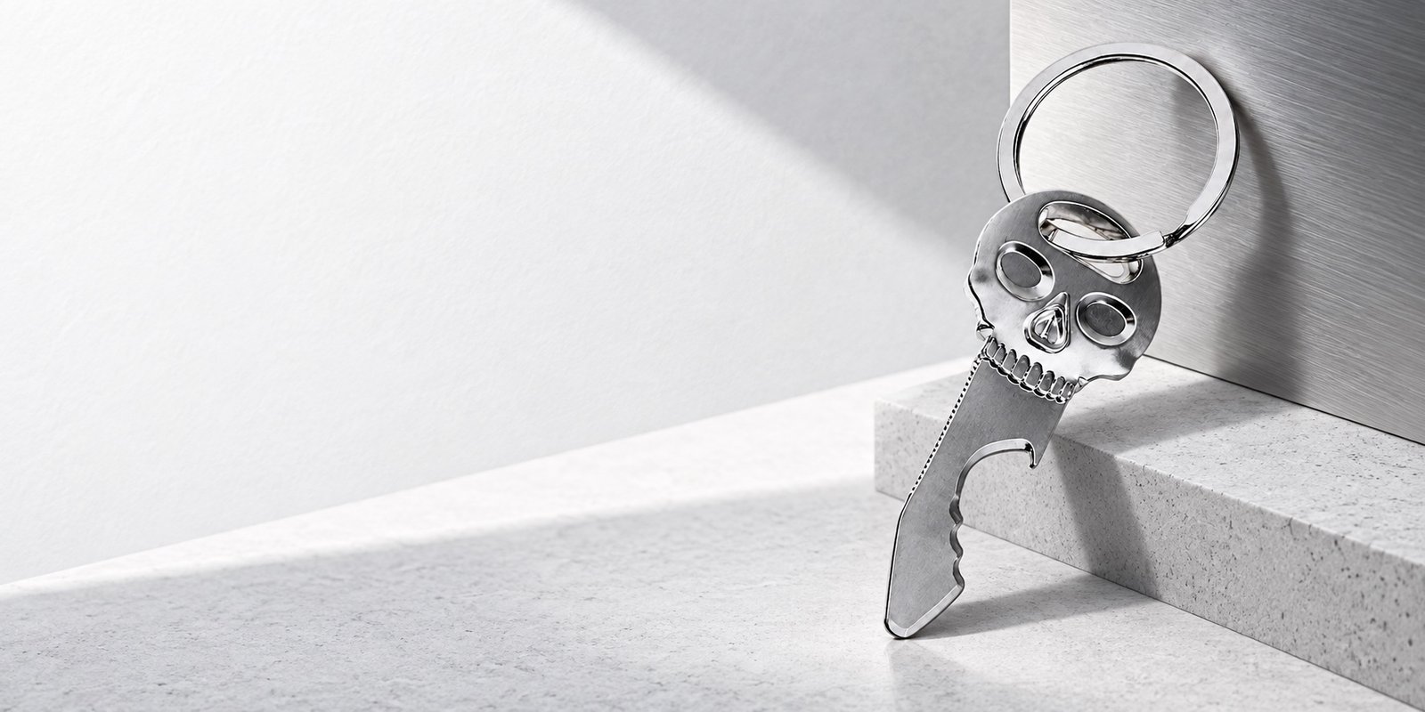 Editorial banner featuring minimalist keychains